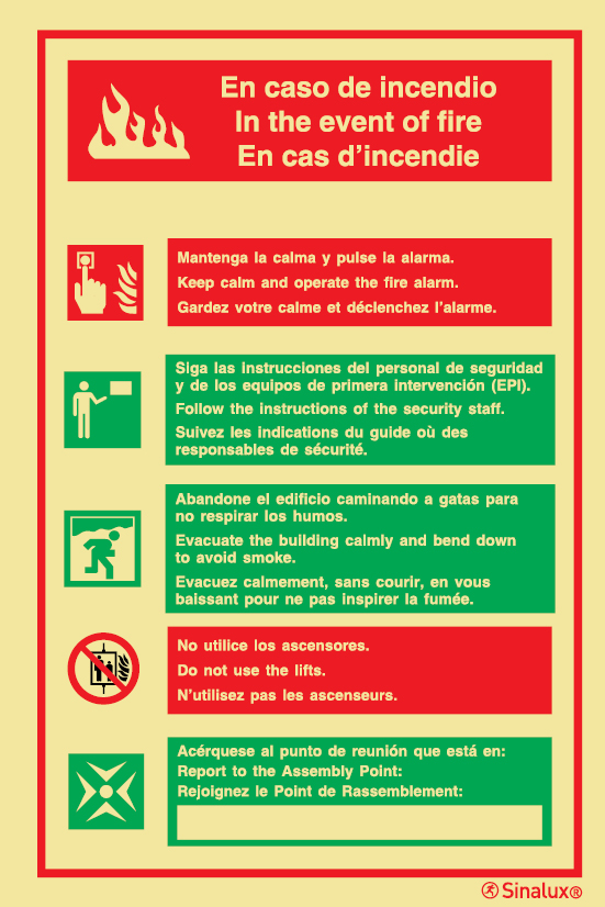 Señal con instrucciones de seguridad contra incendios en tres lenguas