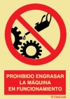 Señal de prohibición con el pictograma y texto de prohibido engrasar la máquina en funcionamiento